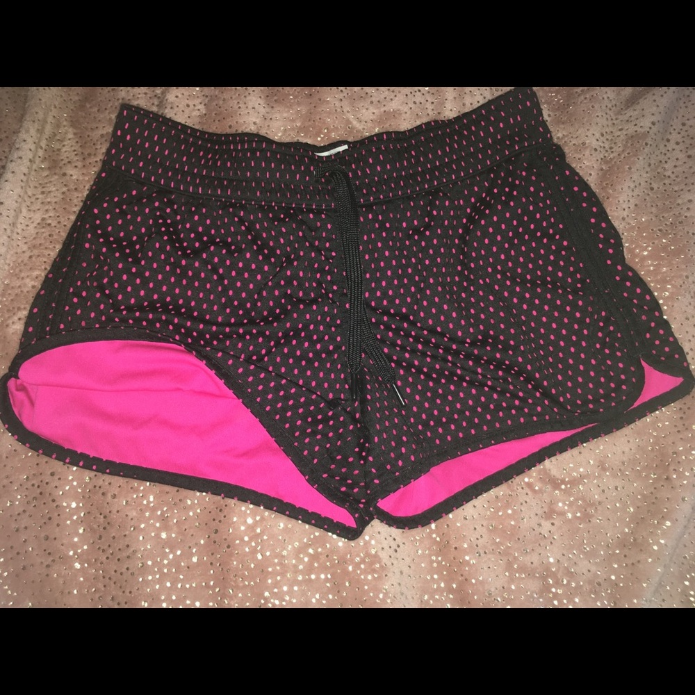 Pink and black running shorts